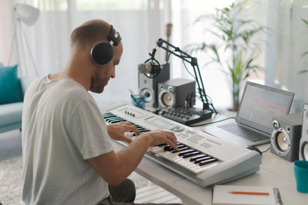 istock Professional musician composing music at home 1328815828