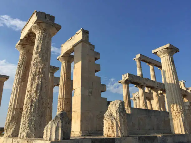 Photo of The Temple of Aphaia or Afea is located within a sanctuary complex dedicated to the goddess Aphaia on the Greek island of Aigina, which lies in the Saronic Gulf. This great Doric temple was formerly known as the Temple of Jupiter Panhellenius.