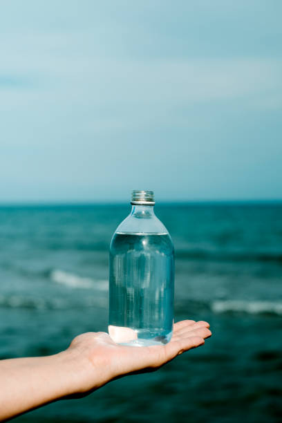 istock has a reusable bottle full of water in his hand 1328820715