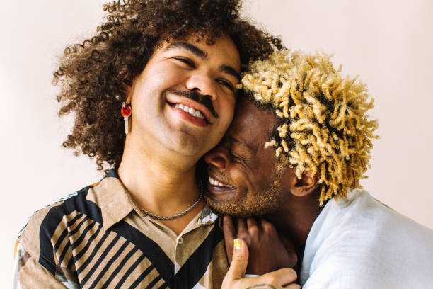 istock Smiling gay couple in a studio 1328820736