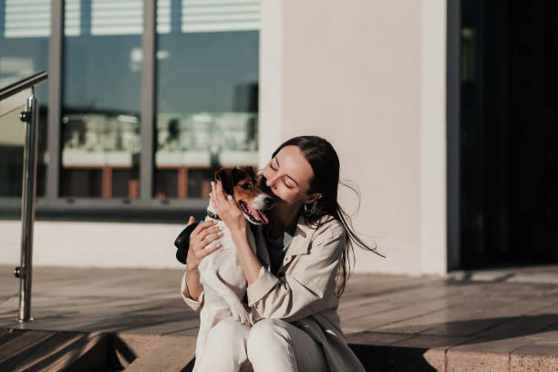 istock Girl kissing hugging dog 1328821160