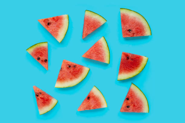 istock Watermelon slices on blue background. Top view 1328822933