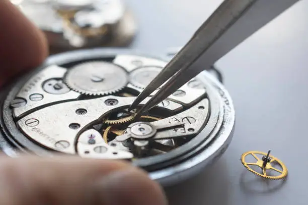 Watchmaker repair mechanical watches. Gears repair. Watch repair process