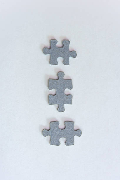istock three grey individual parts of one puzzle 1328829820