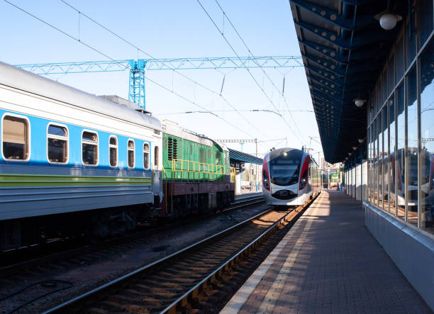 istock Modern high-speed train moves fast along the platform. Train arrive. The train arrives at the train station. Old passenger trains waiting. 1328830306