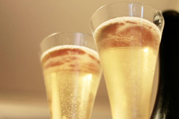 istock Bottle of champagne and a pair glasses before drinking 1328831151