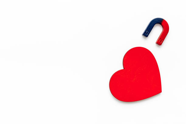 istock Love and relashionship concept. Horseshoe magnet with heart shapes 1328831908