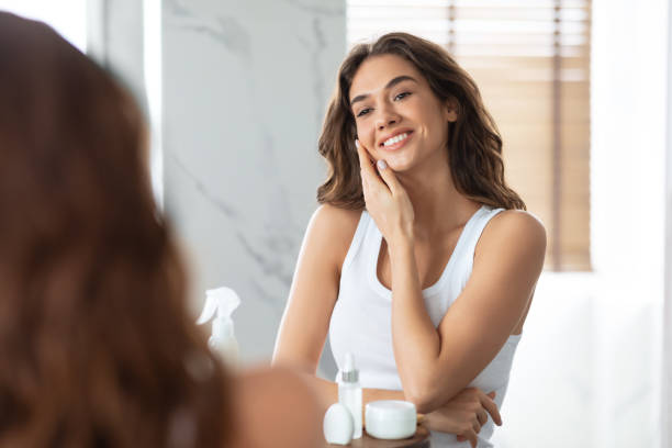 istock Pretty Lady Touching Face With Perfect Smooth Skin In Bathroom 1328832198