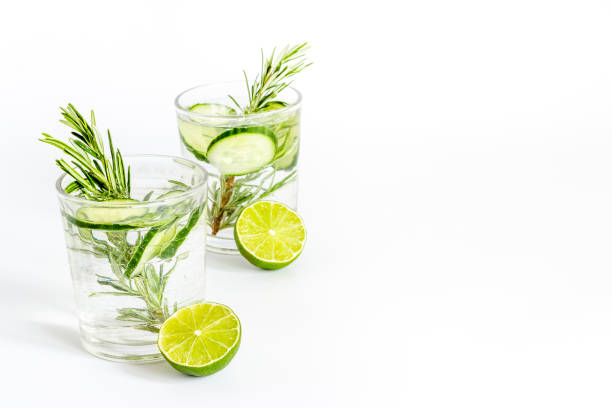 istock Lemonade with cucumber lime and herbs in glasses 1328833193