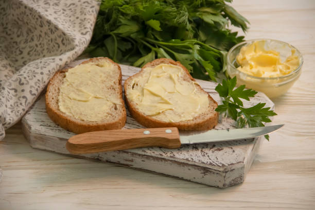 istock butter, bread, parsley on a wooden background 1328834493