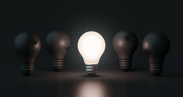 istock Glowing idea light bulb and innovation thinking creative concept on success inspiration dark background with solution symbol of electric lamp design. 3D rendering. 1328835134