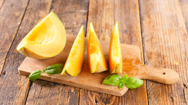 istock fresh melon slice on wooden board 1328835176