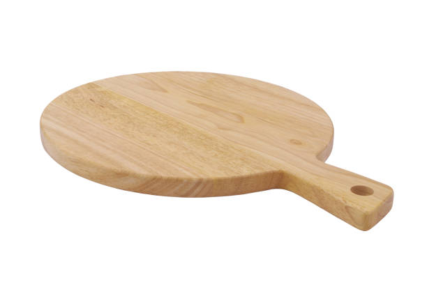 istock Wooden pizza cutting board isolated on white 1328835393