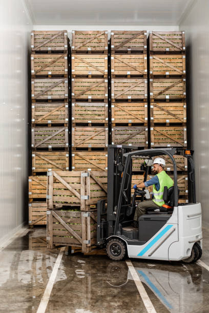 istock Modern warehouse, work on forklift, industry and organic agribusiness 1328836828