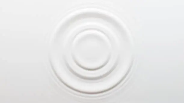 Photo of Circular ripples on the surface of the milk