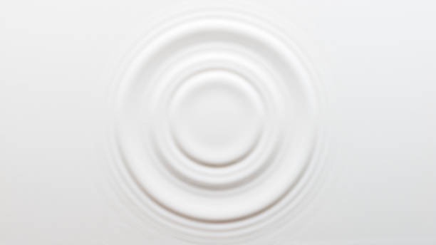 circular ripples on the surface of the milk - milk white imagens e fotografias de stock