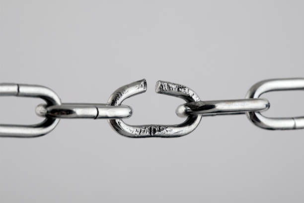 Broken silver metal chain, concept of freedom.