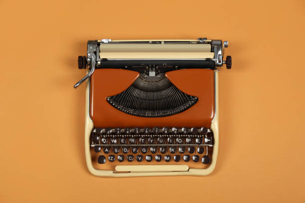 istock Vintage typewriter on brown background, top view 1328841458