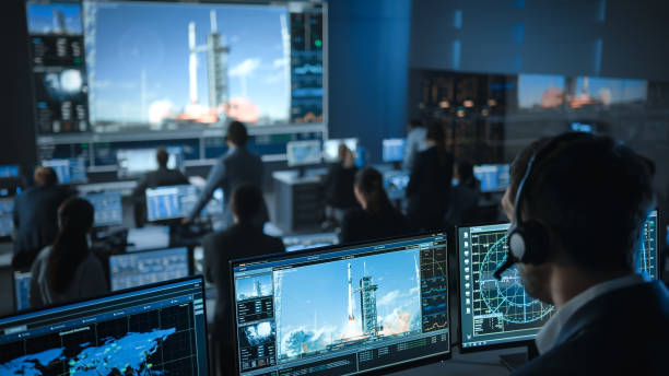 istock Space Flight Dispatcher in Mission Control Center Witness Successful Space Rocket Launch. Flight Control Employees Sit in Front Computer Displays and Monitor the Crewed Mission. 1328841996