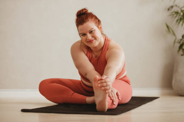istock Plus size woman exercising in fitness studio 1328846778