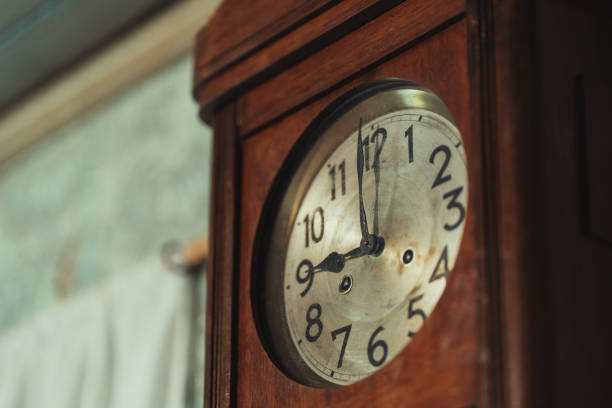 istock Old wooden clock on the wall 1328846942