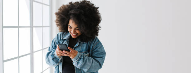 Attractive woman texting on mobile phone