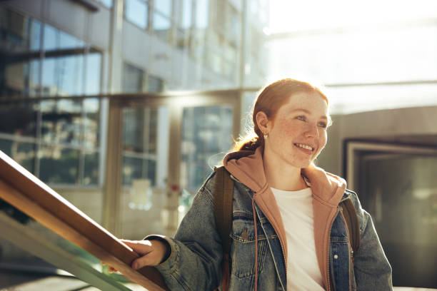 istock Confident female student in college 1328847056
