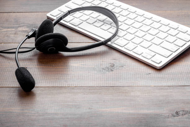 istock Voip headset on computer laptop. Hotline or call center support 1328848511
