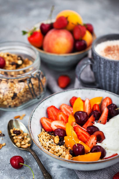 istock Healthy breakfast with granola, yogurt, fresh berries and coffee 1328850752