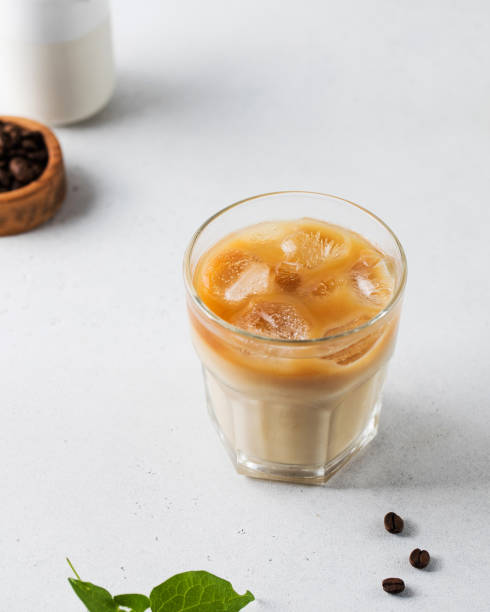 istock Cold coffee with ice and cream on a white background. Homemade cold latte. 1328850979