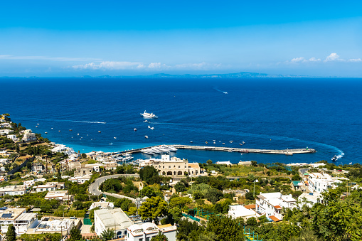 Beautiful panorama of sea and bay on Capri island full of trees and buildings