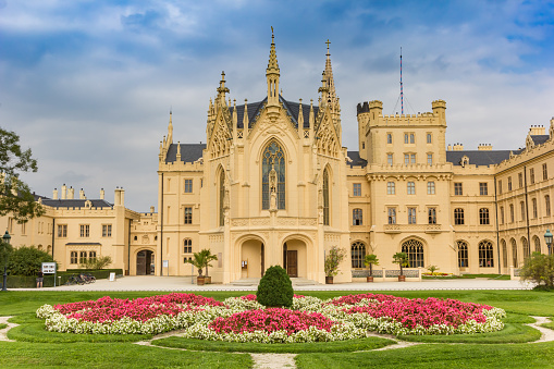 Flowers and front facade of the castle in Lednice, Czech Republic