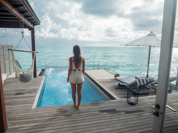 istock Woman enjoying luxury vacations 1328853749