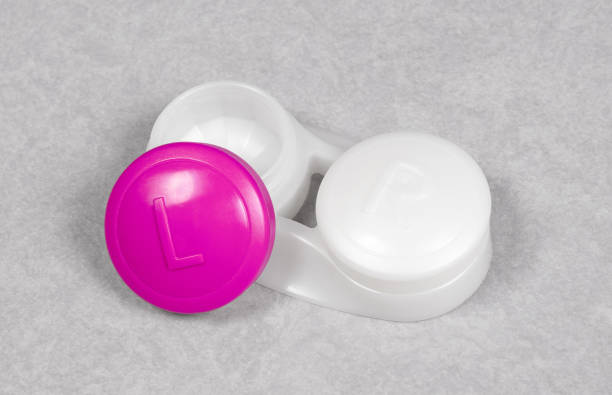 istock Pink contact lens case, isolated on grey background 1328853782
