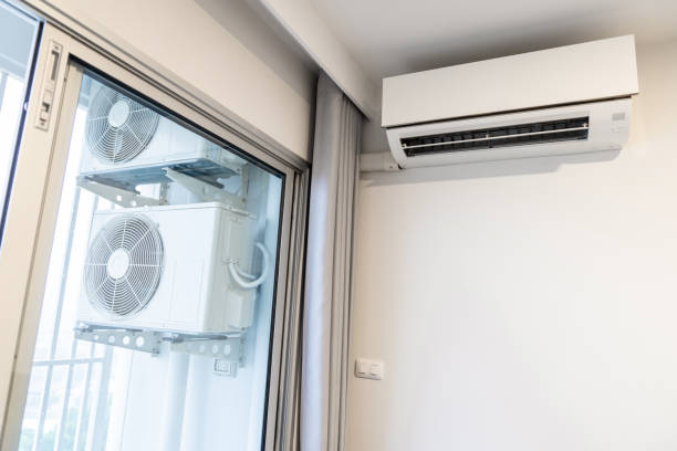 istock two air conditioning compressors are hung on wall. 1328854968