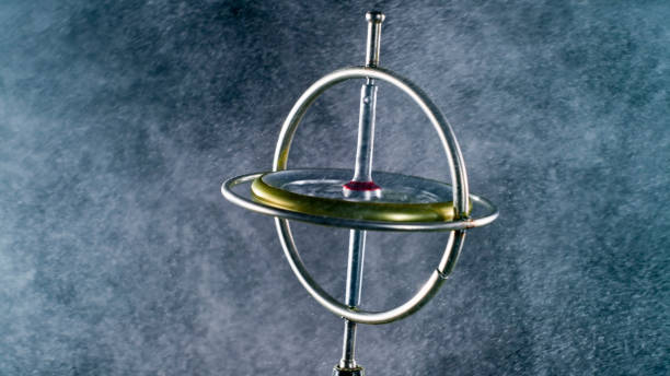 istock Metal gyroscope rotating in glitter dust 1328855260