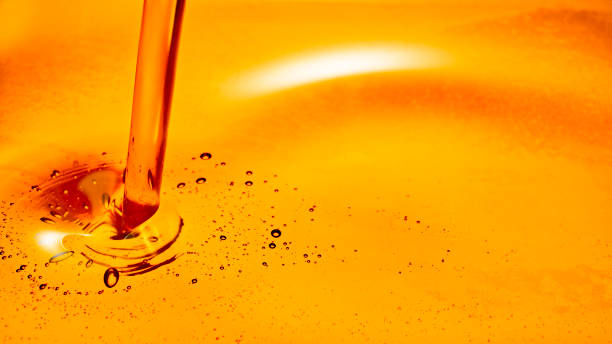 istock Motor oil bubbling when poured 1328855322