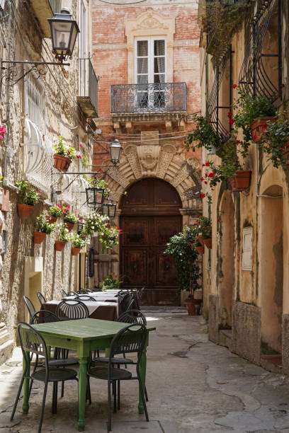 one of the narrow, picturesque street in Tropea, touristic town in Calabria, Italy stock photo