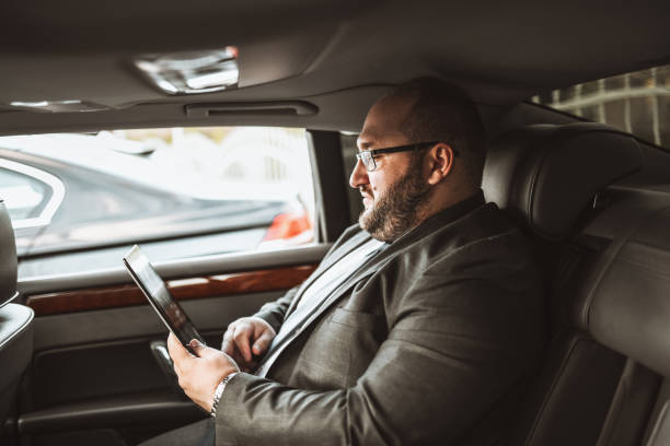 istock Businessman Having Video Conference On Digital Tablet While Traveling 1328857831