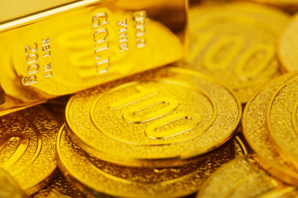 istock Gold bars and gold coins 1328858172