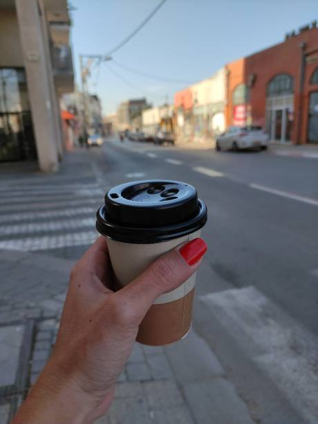 istock Drinking coffee at the street 1328858348