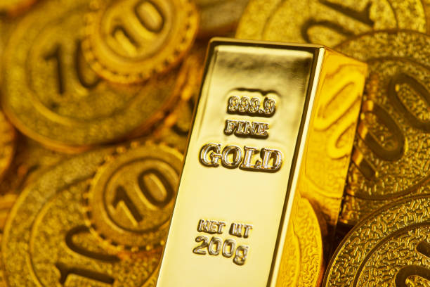 istock Gold bars and gold coins 1328858378