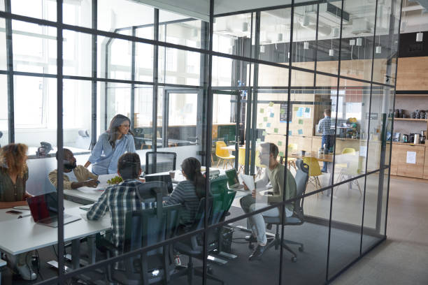 istock Staff discussing plans and bargains for future 1328859114