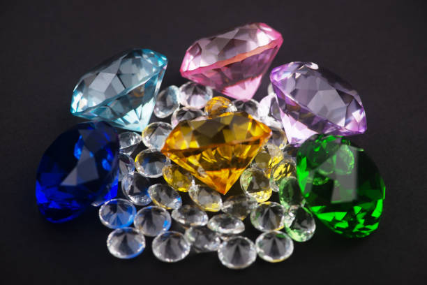 istock Colorful diamonds on black background 1328859147