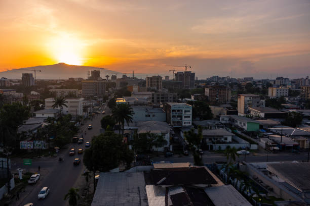 Beautiful View of Douala at Sunset Rooftop view from Bonanjo of the City of Douala with Mount Cameroon visible in the background cameroon photos stock pictures, royalty-free photos & images