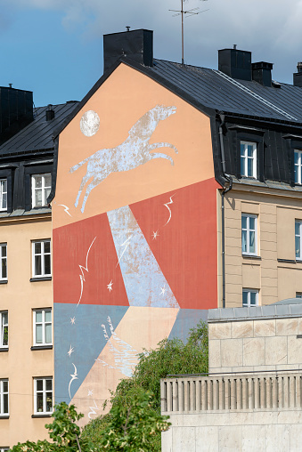 stockholm sweden july 12 - 2021 painted artwork mural on house facade in stockholm city- place södermalm .