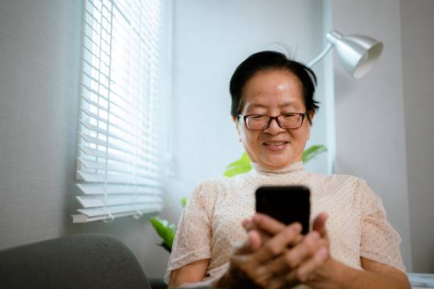 istock Senior Asian woman using a smartphone . 1328865007