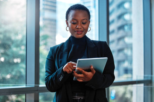 istock Shot of a young businesswoman using a digital tablet at work 1328869712