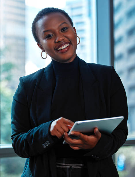 istock Shot of a young businesswoman using a digital tablet at work 1328869715