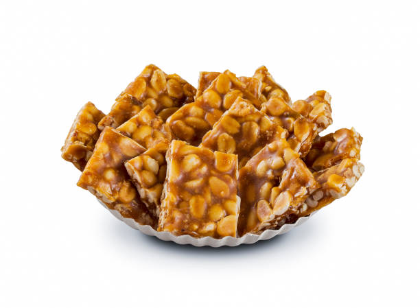 Brazilian peanut brittle Food "Pe de moleque"June party "Festa Junina" white background. Brazilian peanut brittle Food "Pe de moleque"June party "Festa Junina" white background. peanut food stock pictures, royalty-free photos & images